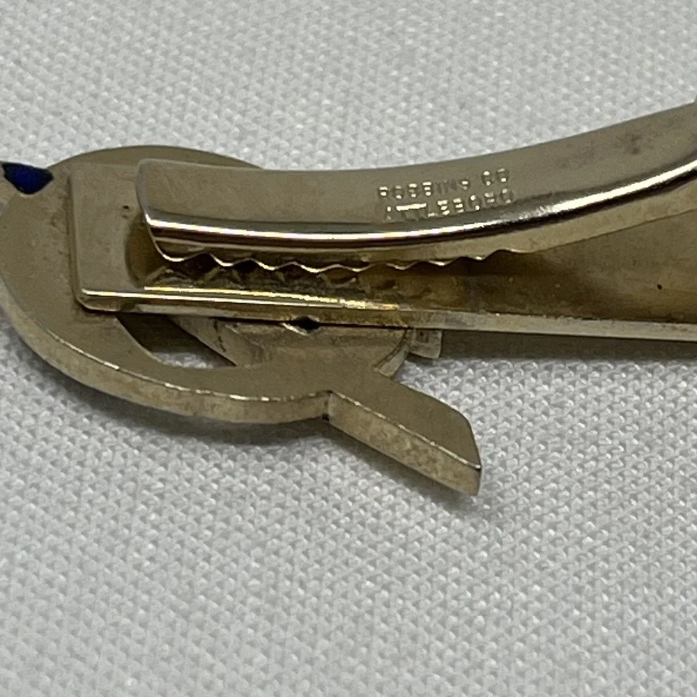 This is a vintage Boy Scouts of America (BSA) Explorer Scout tie clip.